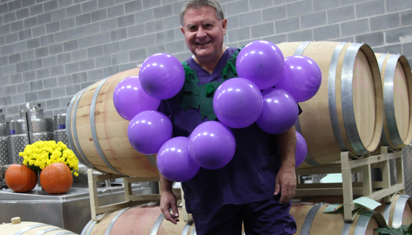 grape stomper dressed as grape pod