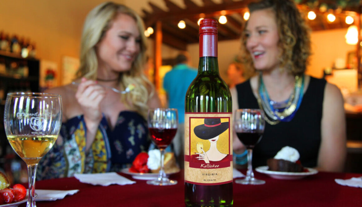 two women eating desert with a bottle of Kelliokee wine