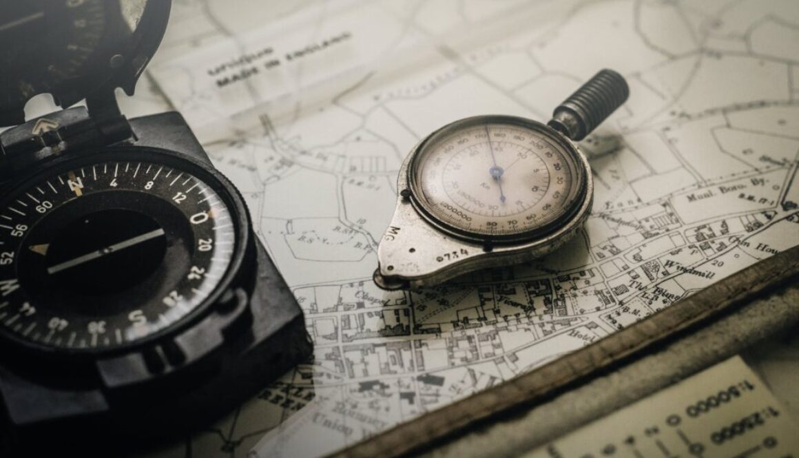 a compass sitting on a paper map