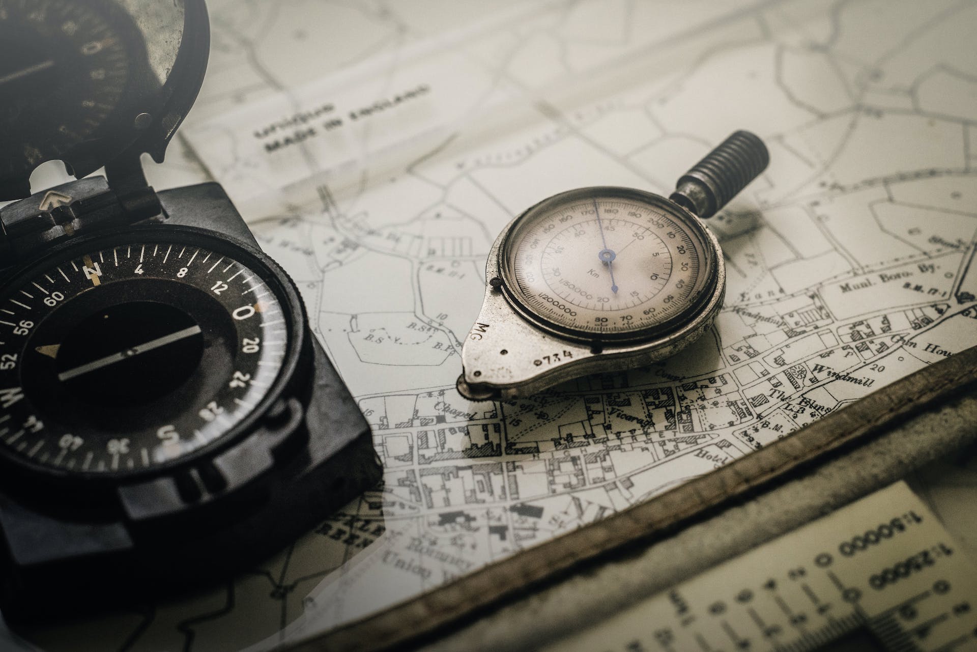 a compass sitting on a paper map